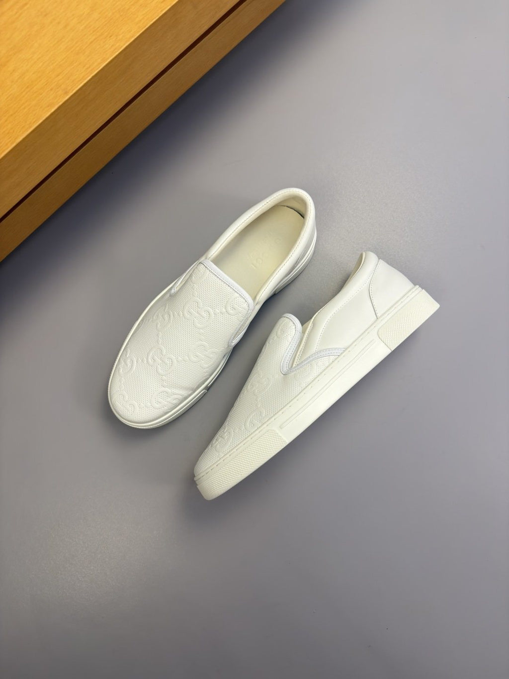 Ivory White Embossed Slip-On Sneakers